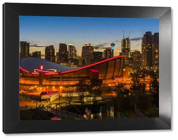 Night view of Saddledome stadium and city skyline, Calgary, Alberta, Canada