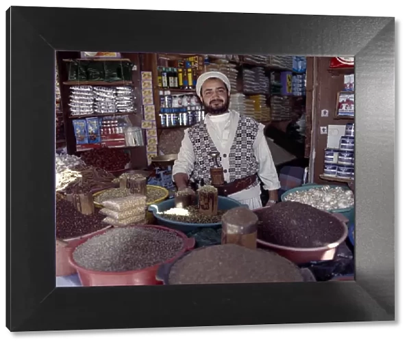 A Yemeni trader at his market stall in the old Suq