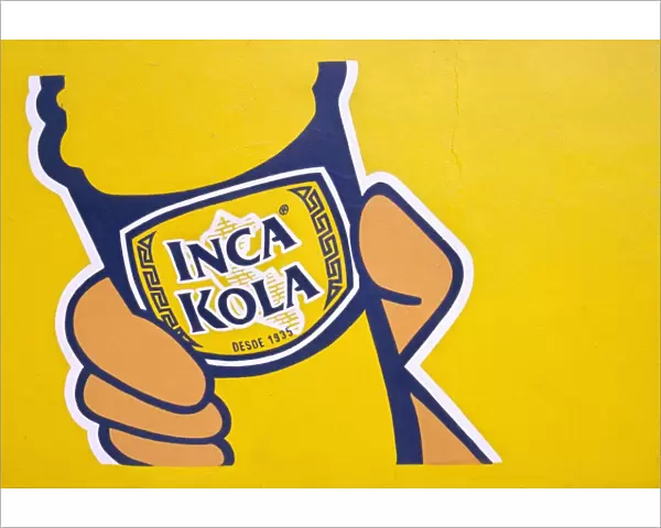 A painted sign for Inca Kola
