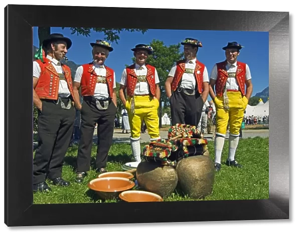 Cowbell ringers in Traditional Alpine Costume at the