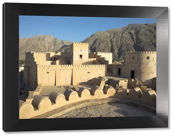 Oman, Al-Batinah Region, Nakhal, Nakhal Fort with the Jebel Nakhal mountains in the