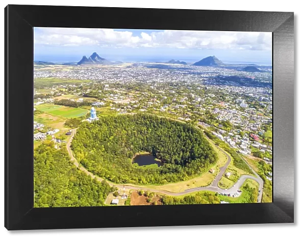 Aerial view of Trou Aux cerfs volcano crater with Curepipe city, Rempart mountain