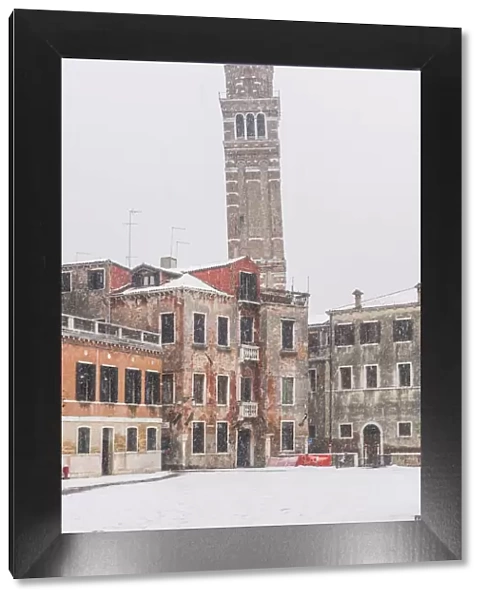 Venice, Veneto, Italy. The leaning bell tower of Santo Stefano under a snowfall