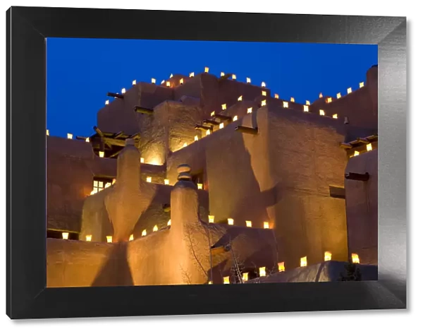 Lanterns lighting adobe building, Santa Fe, New Mexico, USA