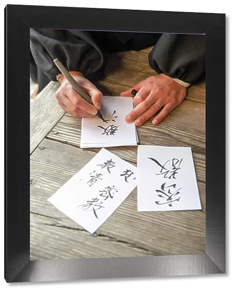 Monk writing calligraphy at Ekoin temple, Koya, Mount Koya, Kansai region, Honshu, Japan