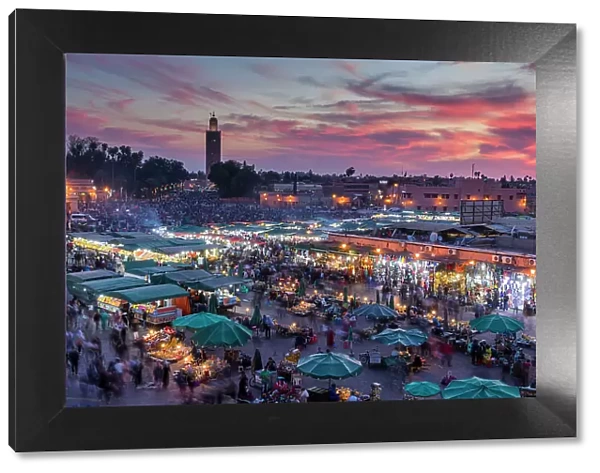 View over Djemaa el-Fna square and market place at dusk, Marrakesh, Morocco