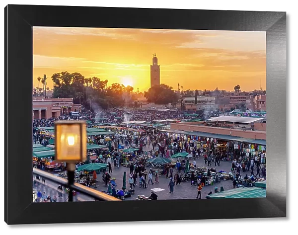 Djemaa el Fna square full of crowd at sunset, Marrakech, Morocco