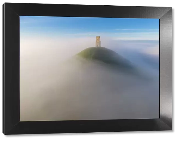 St Michael's Tower on Glastonbury Tor, surrounded by a sea of mist, Glastonbury, Somerset, England. Autumn (November) 2022