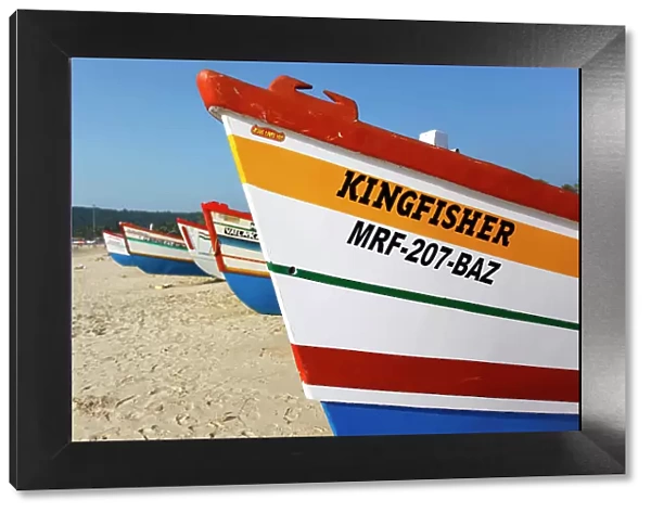Colorful wooden fishing boats in a beach of Goa, West India