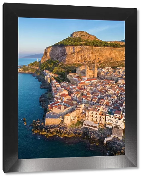 Aerial view of the ancient town of Cefalu, Unesco World Heritage site, at sunset. Palermo district, Sicily, Italy
