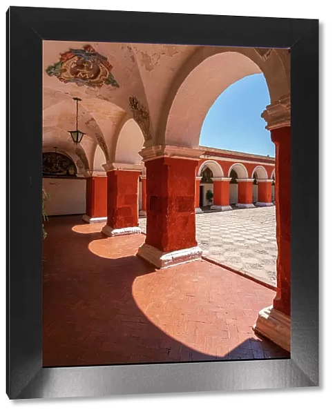 Corridor with red walls and columns at Monastery of Santa Catalina de Siena, UNESCO, Arequipa, Arequipa Province, Arequipa Region, Peru