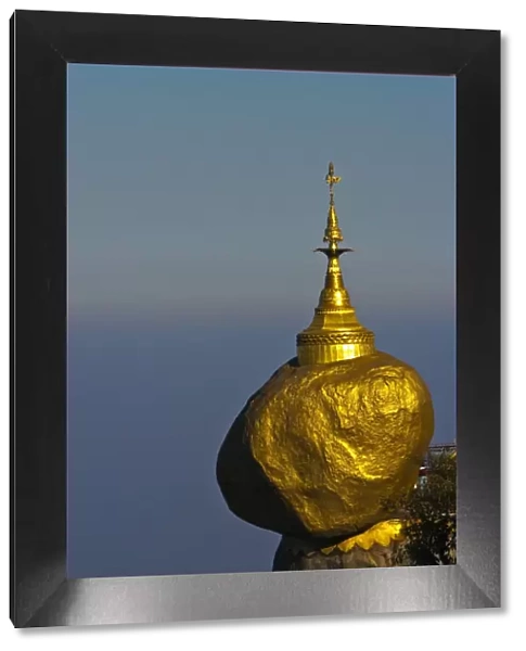Myanmar, Burma, Golden Rock, Kyaiktiyo. The Golden Rock boulder balanced precariously on the edge of