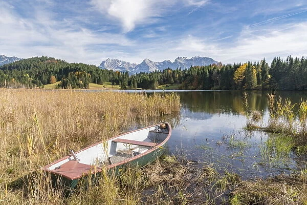 Abandoned boat on the shores of Gerold Lake. Krun, Upper Bavaria, Bavaria, Germany