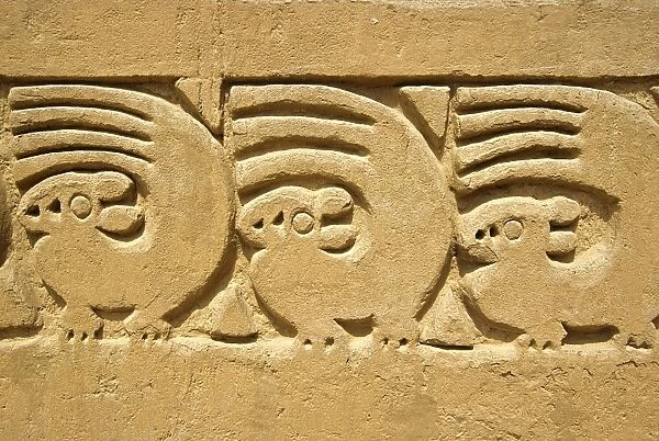 Adobe wall frieze incorporating sea otter and wave