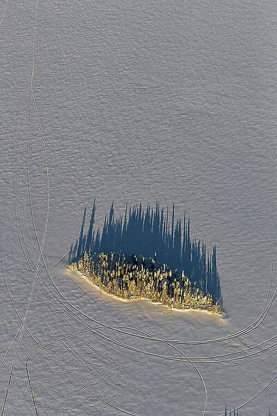 Aerial of island in frozen lake, Kuusamo, Finland