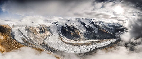 Aerial panoramic of Gorner Glacier (Gornergletscher) covered by clouds, Zermatt