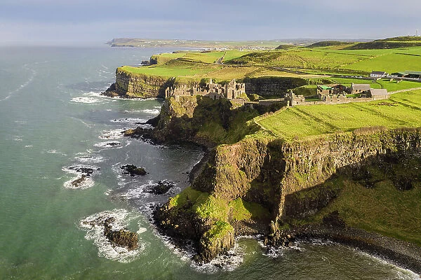 Aerial view of Dunluce Castle on the Causeway Coast, County Antrim, Northern Ireland. Autumn (November) 2022