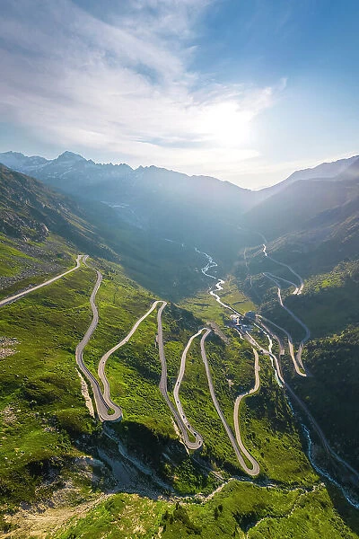 Aerial view of the Grimselstrasse connecting with Furkastrasse and Furkapass at sunrise. Obergoms, Canton of Valais, Swiss Alps, Switzerland