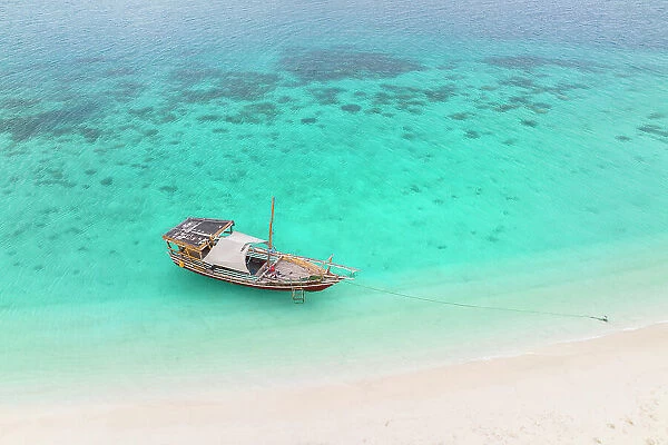 aerial view taken by the drone of the tourist boat, anchored near a tongue of sand, Zanzibar, Tanzania