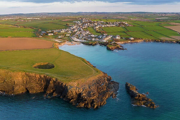 Aerial view of Trevone Bay and the Round Hole near Padstow on the north coast of Cornwall, England. Spring (April) 2021