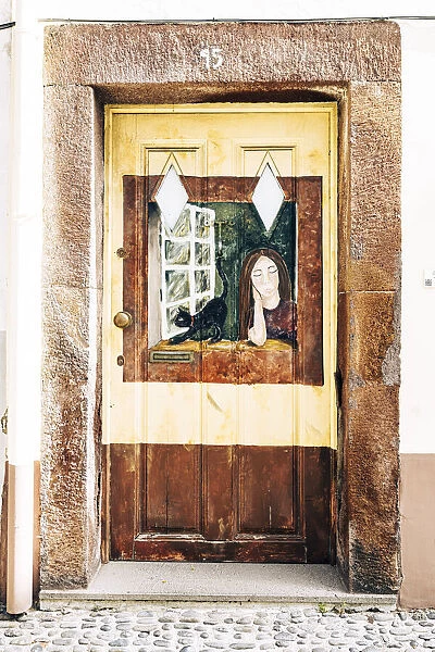 Artistic paintings on house door in the old alley Rua de Santa Maria, Funchal