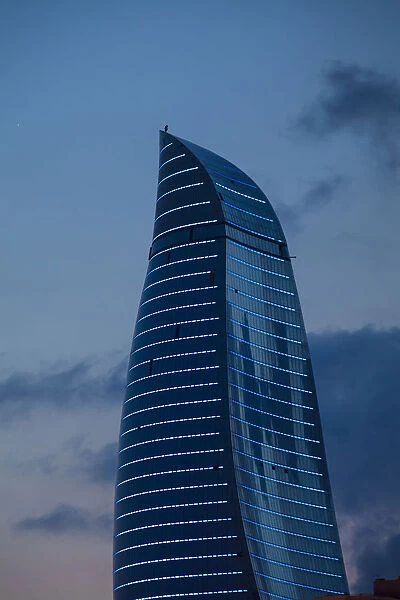 Azerbaijan, Baku, View of one of the three Flame Towers at dusk