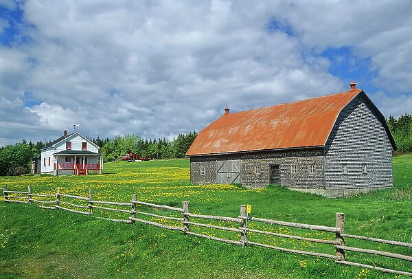 Barn, house and fence on Gaspe Peninsula Grosses-Roches, Quebec, Canada