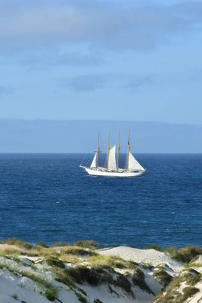The beach dunes in Peniche and the Tall ship Creoula, Portugal
