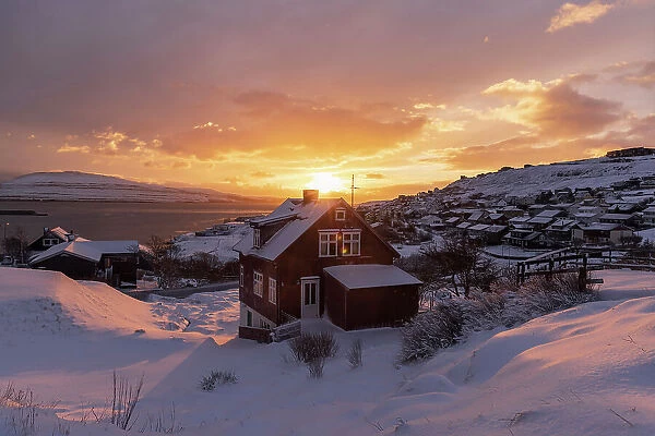A beautiful view of Argir covered by snow at sunrise. Island of Streymoy. Faroe Islands
