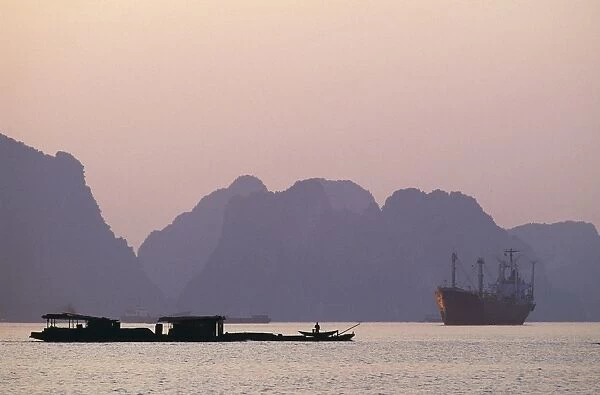 Boats in Ha Long Bay at Sunset