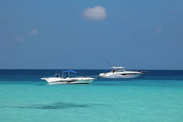 Boats on the turquoise waters of the Indian Ocean, North Ari Atoll, the Maldives