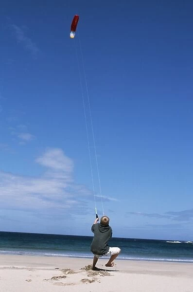 A boy flies a kite on one of Colls many
