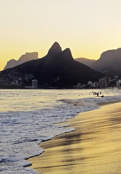 Brazil, City of Rio de Janeiro, Ipanema Beach and Morro Dois Irmaos during sunset