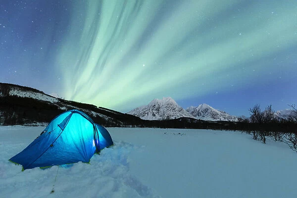 Camping with tent during a night with the Northern Lights