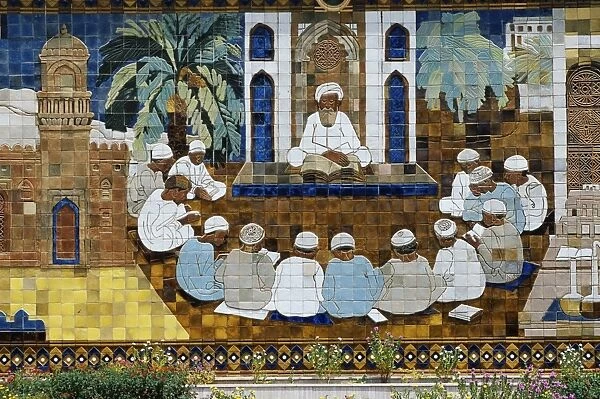 A ceramic panel depicting an Imam teaching the Koran
