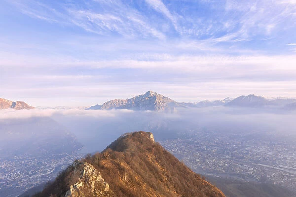 City of Lecco and the village of Valmadrera under the morning fog