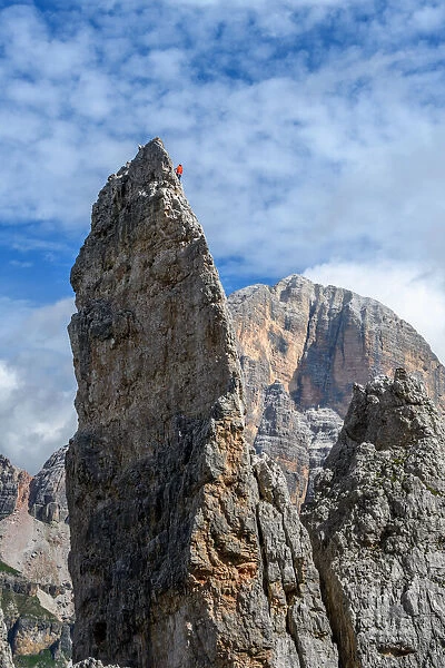 Climber on Cinque Torri (Tofane on background), Cortina d Ampezzo, Belluno district
