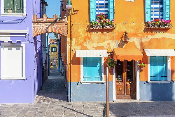 A close up view of the colorful houses of Burano Island (near Venice) on a sunny summer morning. Burano, Venezia, Italy