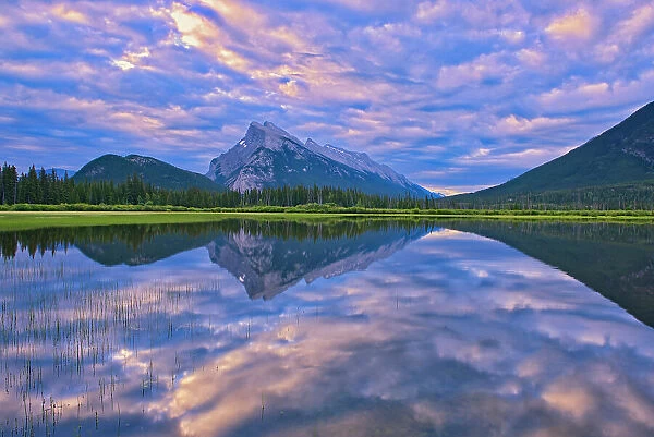 Clouds and Mt. Rundle reflected in Vermillion Lakes at sunrise, Banff National Park, Alberta, Canada