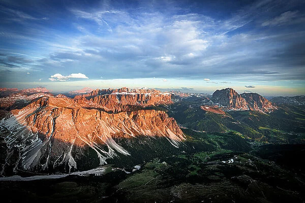Clouds at sunset over Gardena Valley, Cirspitzen, Sella group, Sassolungo and Sassopiatto, Dolomites, South Tyrol, Italy