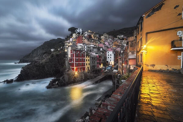 Cloudy evening over the village of Riomaggiore, National Park of Cinque Terre
