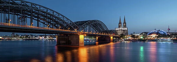 Cologne Cathedral and Hohenzollern Bridge at dusk, Cologne, North Rhine-Westphalia, Germany