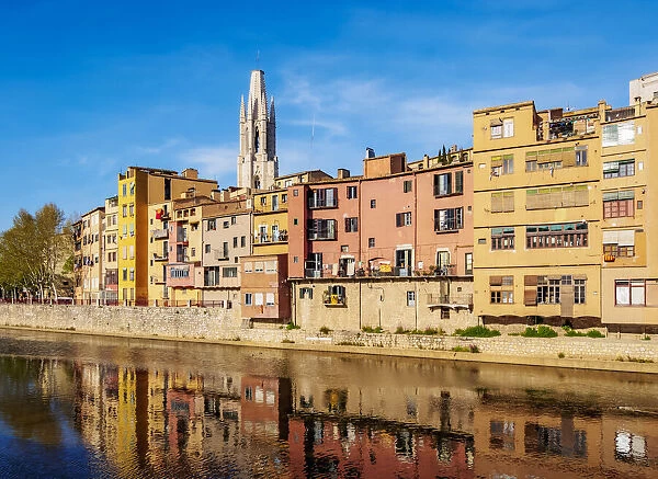 Colourful houses and Sant Feliu Basilica reflecting in the Onyar River, Girona or Gerona