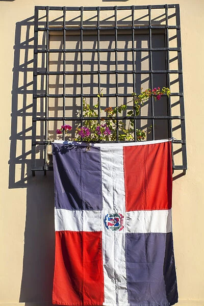Dominican Republic, Santa Domingo, Colonial zone, Dominican flag hanging from window