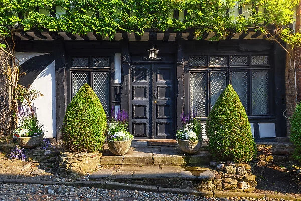 A front door of a house of famous Mermaid Street of Rye during sunset, Rye, Rother, East Sussex, England, United Kingdom