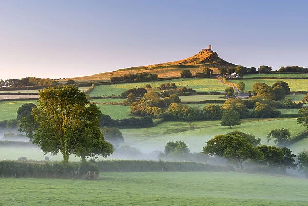 Early morning mist in the rolling farmland below Brentor at dawn, Dartmoor National Park