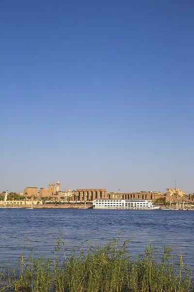 Egypt, Luxor, View of cruise boat infront of Luxor temple