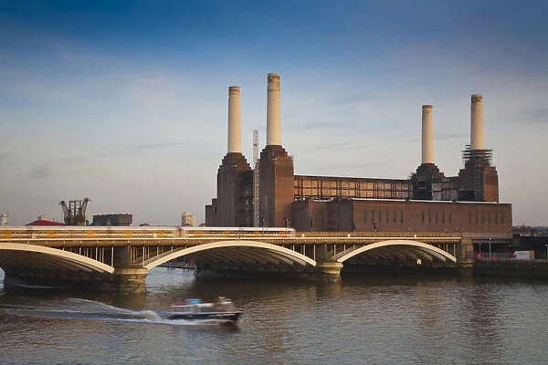 England, London, Chelsea, Train crossing Grosvenor bridge infront of Battersea power