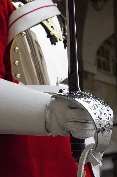 England, London. A Guardsman in the Household Cavalry holding a Ceremonial Sword