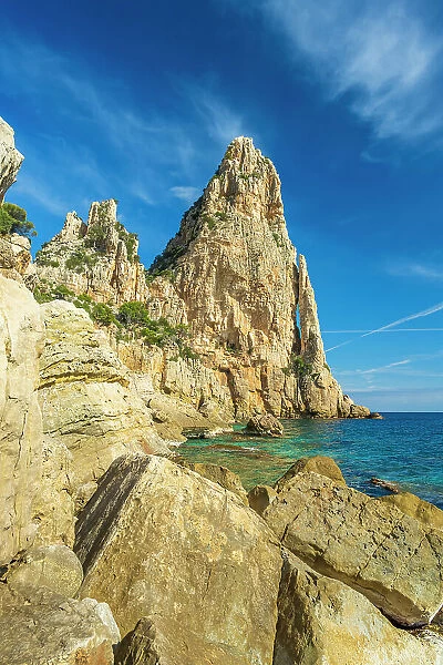 Europe, Italy, Sardinia. On the rocky beach near to the caracteristic rock needle Pedra Longa
